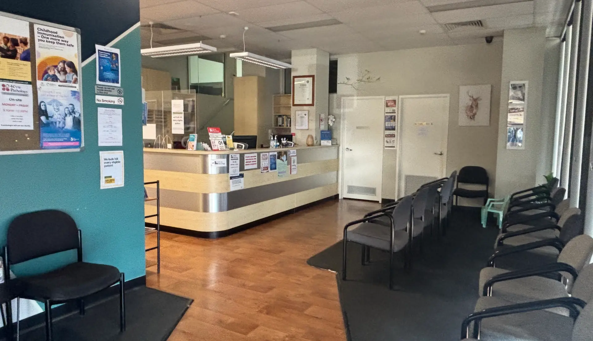 The practice reception and waiting area with seating and front desk